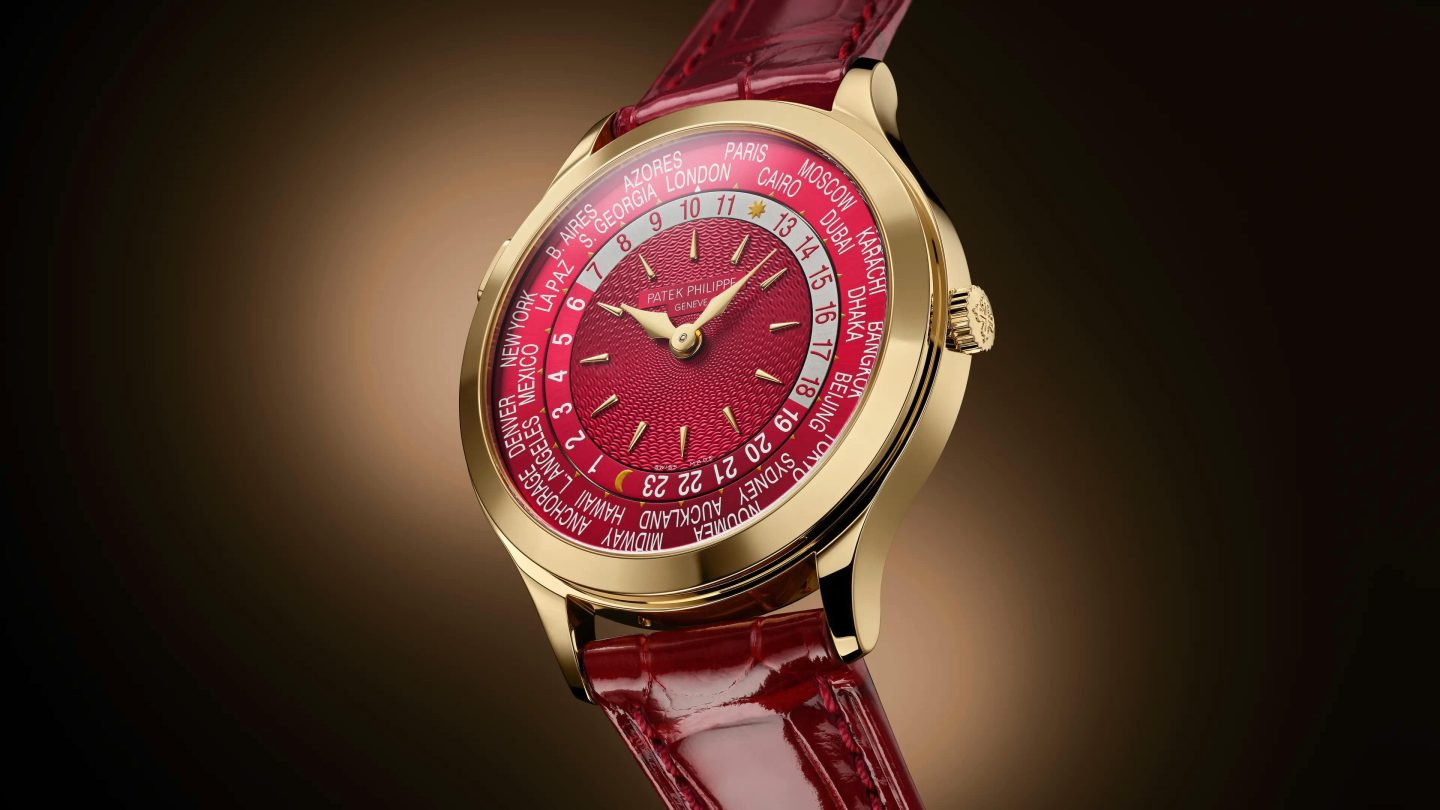 Patek Philippe World Time 7129J-001 in yellow gold with red dial
